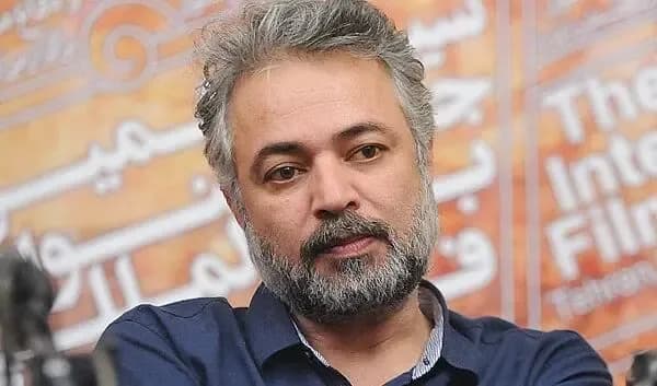 عکس دیده نشده از جوانی حسن جوهرچی با موهای بلند و چهره خندان در دهه 70